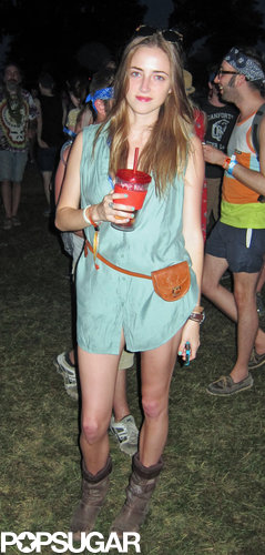 Easy, breezy styling caught our eye here. Her oversize top — worn as a silky dress — cinched at the waist with a belt bag offered up a cool way to dress for the evening sets.
Easy, breezy styling caught our eye here. Her oversize top — worn as a silky dress — cinched at the waist with a belt bag offered up a cool way to dress for the evening sets.