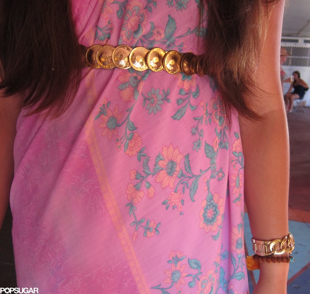 A close-up of Tamora's gold-coin belt — a gorgeous accent to her dress's softer floral-print palette.
A close-up of Tamora's gold-coin belt — a gorgeous accent to her dress's softer floral-print palette.