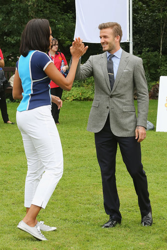 In July 2012, First Lady Michelle Obama high-fived David Beckham during a Let's Move London event.
In July 2012, First Lady Michelle Obama high-fived David Beckham during a Let's Move London event.