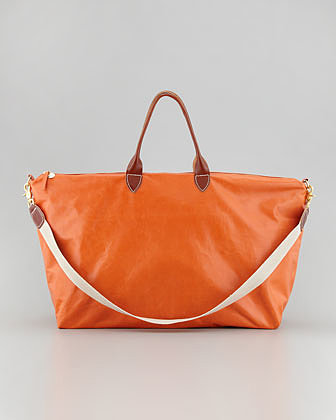 Clare Vivier's orange dyed leather weekender ($483) is a surefire way to get you noticed, plus it'll pop against a cool denim ensemble.
Clare Vivier's orange dyed leather weekender ($483) is a surefire way to get you noticed, plus it'll pop against a cool denim ensemble.