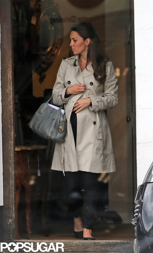 Kate Middleton wore a black outfit and a trench coat.
Kate Middleton wore a black outfit and a trench coat.