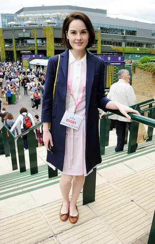 It's not a stretch to envision the Downton crew enjoying a spot of tennis. Michelle Dockery, aka Lady Mary, took in the scene in a pale pink dress and navy topper.
It's not a stretch to envision the Downton crew enjoying a spot of tennis. Michelle Dockery, aka Lady Mary, took in the scene in a pale pink dress and navy topper.