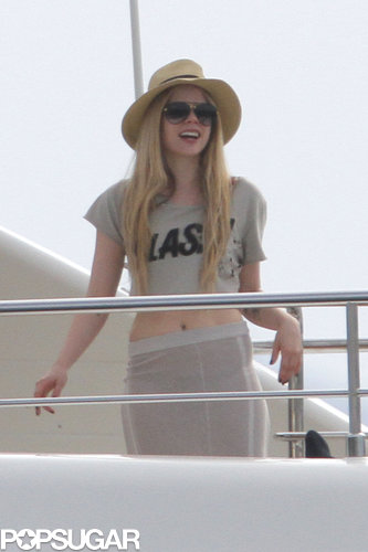 Avril Lavigne wore a crop top and skirt while hanging on a boat with friends.
Avril Lavigne wore a crop top and skirt while hanging on a boat with friends.