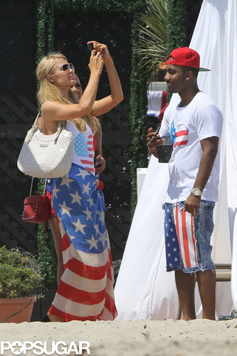 Paris Hilton took out her phone during a Fourth of July fete in 2013 to snap a photo.
Paris Hilton took out her phone during a Fourth of July fete in 2013 to snap a photo.