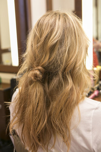 Now your hair should look like this, with a loose knot in the middle of your hair. It might look awkward, but you'll need it for later in the look.
Now your hair should look like this, with a loose knot in the middle of your hair. It might look awkward, but you'll need it for later in the look.