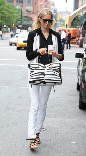 Karolina Kurkova stuck to black and white, including a zebra-print purse, in NYC.
Karolina Kurkova stuck to black and white, including a zebra-print purse, in NYC.