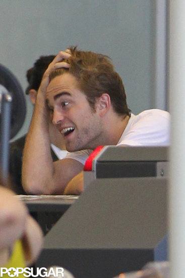 Exclusive: Robert Pattinson Smolders His Way Through Airport Security