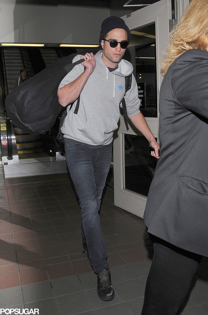 Robert Pattinson walked through LAX. Robert Pattinson walked through LAX.