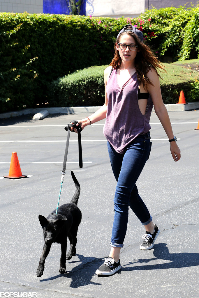 Kristen Stewart walked a black dog in LA and wore Vans tennis shoes. Kristen Stewart walked a black dog in LA and wore Vans tennis shoes.