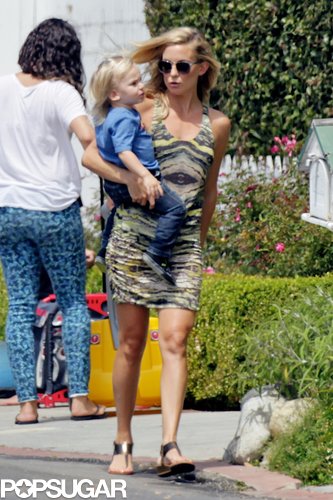 Kate Hudson held on to her son Bingham as she visited Ryder's lemonade stand.
Kate Hudson held on to her son Bingham as she visited Ryder's lemonade stand.