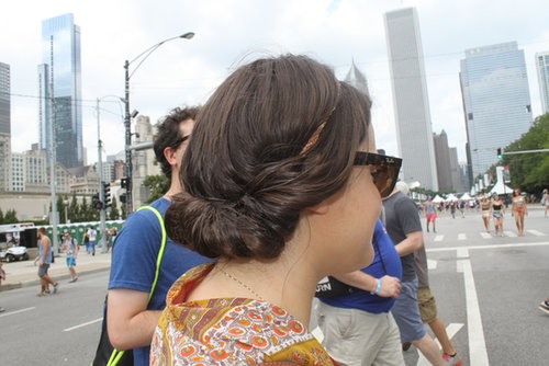 Headbands were the norm on the streets of Lollapalooza, but this festival attendee tucked her hair into an updo that's part chignon, part french roll.
Headbands were the norm on the streets of Lollapalooza, but this festival attendee tucked her hair into an updo that's part chignon, part french roll.