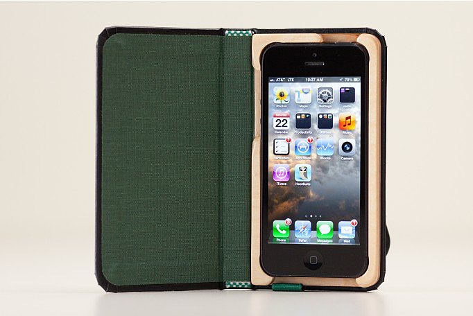 The Little Black Book iPhone 5 case ($40) disguises your iPhone as a little black book, secured by a hand-carved wooden frame and wraparound strap. The inside of the case is lined, making it look even more like an adorable, pocket-sized notebook.
The Little Black Book iPhone 5 case ($40) disguises your iPhone as a little black book, secured by a hand-carved wooden frame and wraparound strap. The inside of the case is lined, making it look even more like an adorable, pocket-sized notebook.