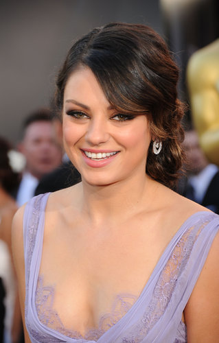 At the Academy Awards later that year, Mila opted for a more ethereal beauty look. With her twisted chignon and petal-pink lipstick, Mila was full-on feminine.
At the Academy Awards later that year, Mila opted for a more ethereal beauty look. With her twisted chignon and petal-pink lipstick, Mila was full-on feminine.