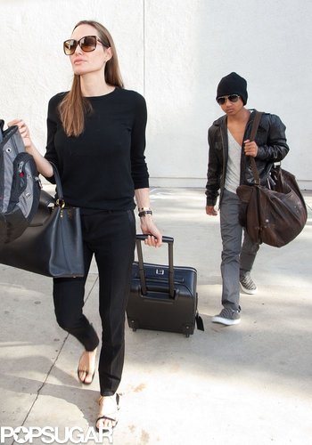 Angelina Jolie walked with Maddox out of the airport.
Angelina Jolie walked with Maddox out of the airport.