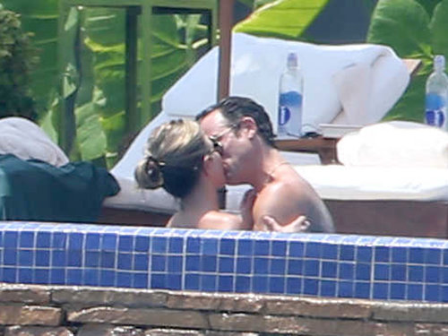 Jennifer Aniston gave fiancé Justin Theroux a steamy kiss in the jacuzzi.
Jennifer Aniston gave fiancé Justin Theroux a steamy kiss in the jacuzzi.