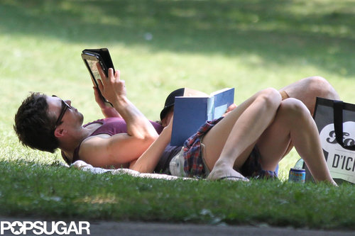 Jennifer Lawrence and Nicholas Hoult read their books at a park in Montreal.
Jennifer Lawrence and Nicholas Hoult read their books at a park in Montreal.