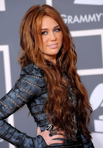 At the 2010 Grammy Awards, Miley went for a totally different look that featured wavy chestnut hair that was more rock star than country.
At the 2010 Grammy Awards, Miley went for a totally different look that featured wavy chestnut hair that was more rock star than country.