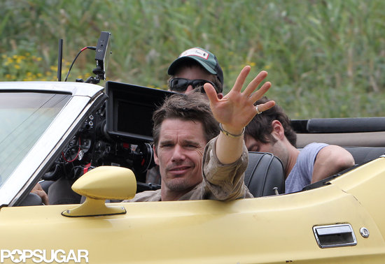Ethan Hawke gave a wave from his canary-yellow car on the NYC set of Cymbeline on Tuesday.
Ethan Hawke gave a wave from his canary-yellow car on the NYC set of Cymbeline on Tuesday.