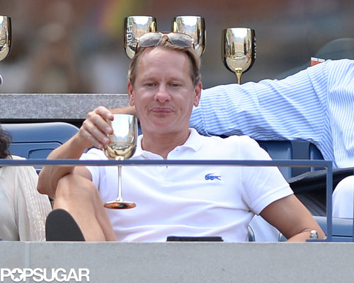 Carson Kressley sipped a beverage from a silver cup.
Carson Kressley sipped a beverage from a silver cup.