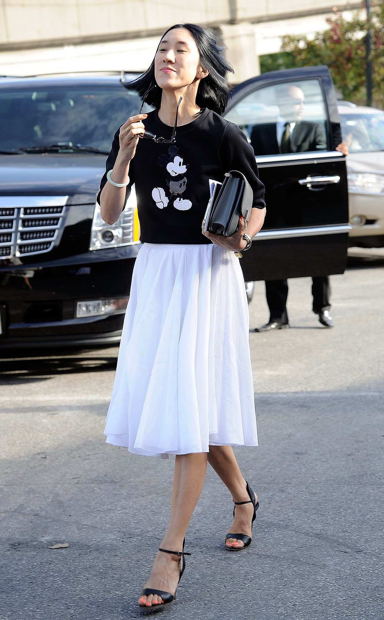 Eva Chen perfected ladylike cool with a full skirt and Mickey Mouse sweater.
