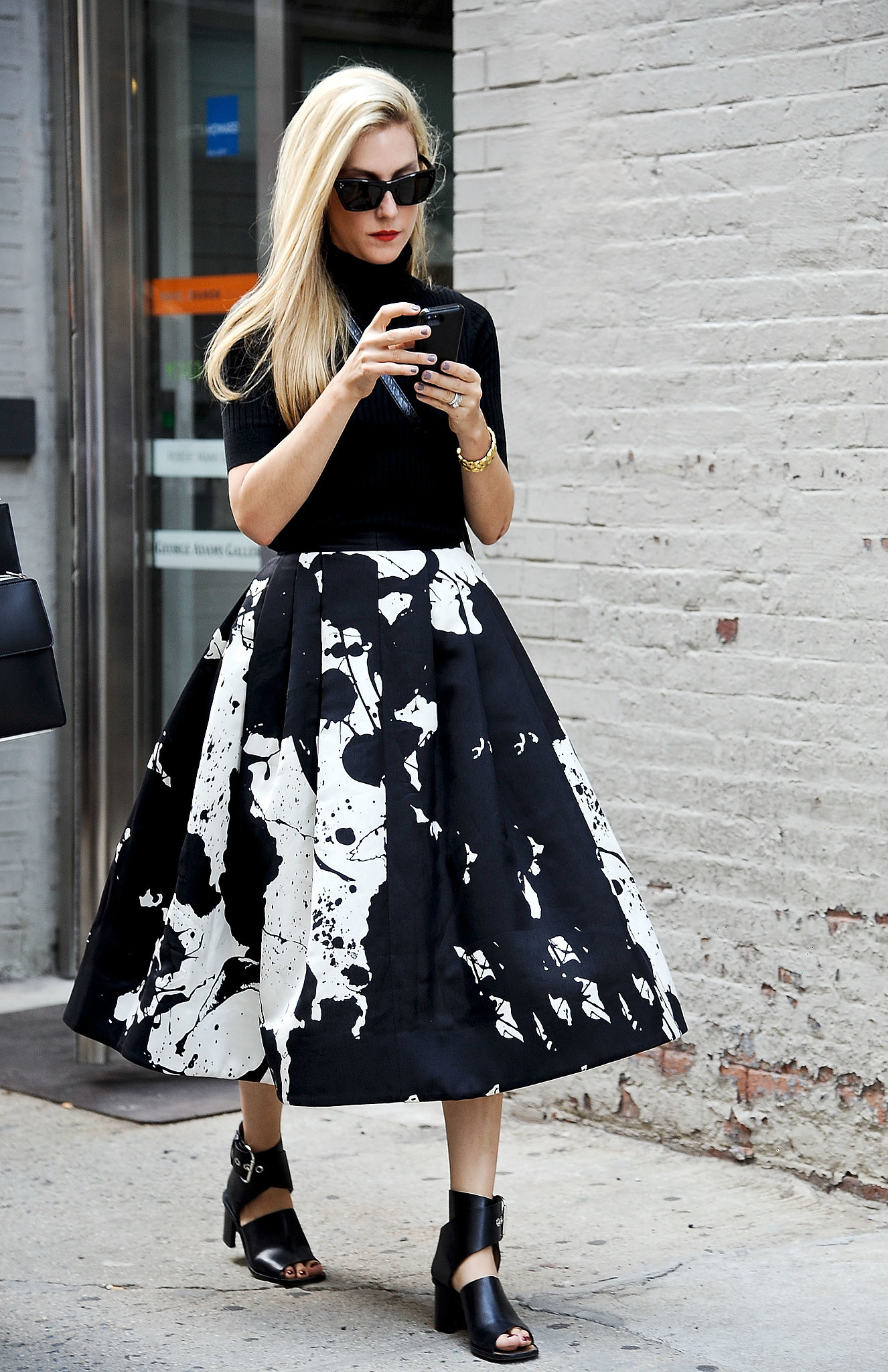 Joanna Hilmman made ladylike look so cool in a paint-splattered Tibi Resort 2014 skirt. 
