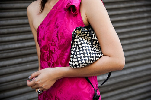 A vintage Bottega Venetta clutch popped against a pretty fuchsia dress.
A vintage Bottega Venetta clutch popped against a pretty fuchsia dress.