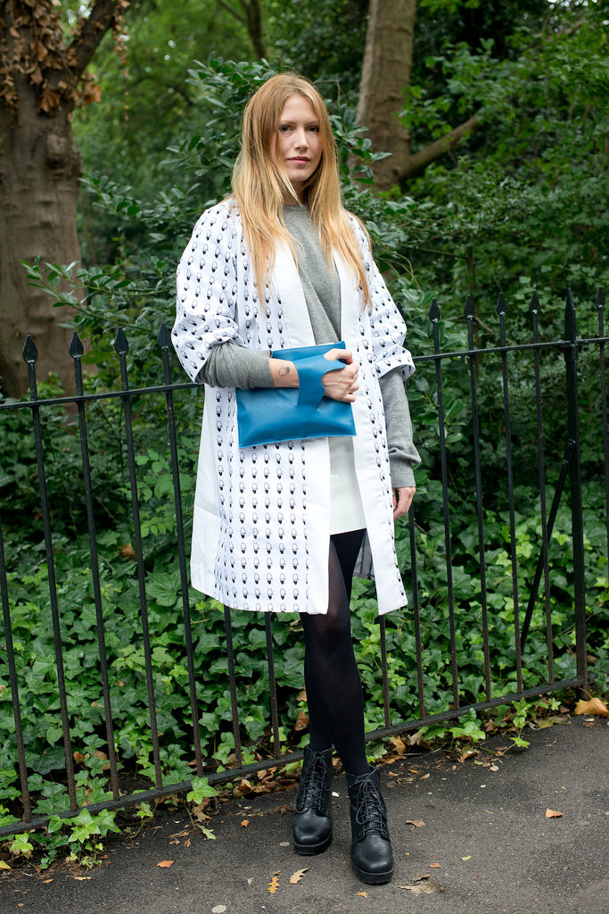 Her printed cardigan and blue zippered clutch added a little quirk to a sweatshirt and tights.
Her printed cardigan and blue zippered clutch added a little quirk to a sweatshirt and tights.