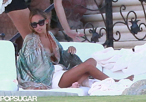 Nicole Richie relaxed by the pool.
Nicole Richie relaxed by the pool.
