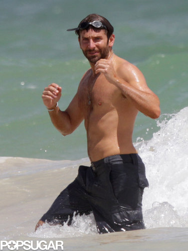 Bradley Cooper showed off his fit physique at the beach in Hawaii.
Bradley Cooper showed off his fit physique at the beach in Hawaii.