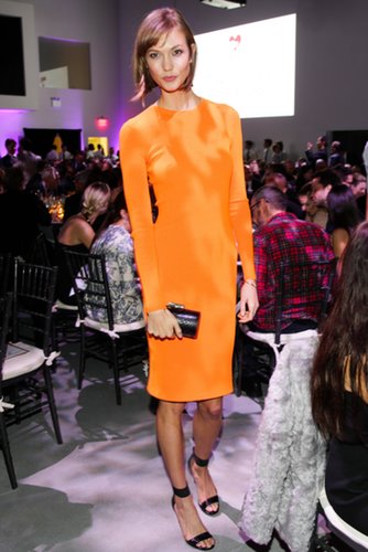 At the Golden Heart Awards, Karlie Kloss couldn't be missed in a Michael Kors neon sheath at the designer's skinny sandals and python clutch.
At the Golden Heart Awards, Karlie Kloss couldn't be missed in a Michael Kors neon sheath at the designer's skinny sandals and python clutch.