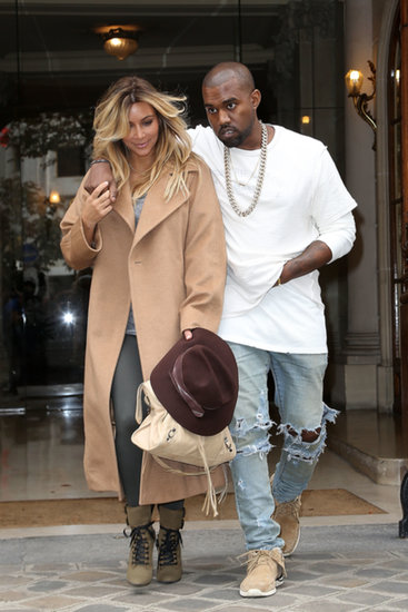 In September 2013, Kanye West put his arm around Kim Kardashian during an outing in Paris.
In September 2013, Kanye West put his arm around Kim Kardashian during an outing in Paris.