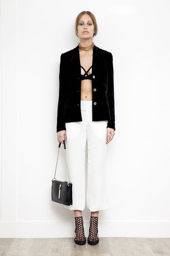Viscose Sports Bra in Black ($150), Velvet Short Blazer in Black ($1,095), Elastic Bottom Silk Pant in Cream ($595), Secret Place Patent Mesh Sandal Bootie in Black ($895), Attraction Patent Shoulder Bag in Black ($1,795)
Photo courtesy of Tamara Mellon
Viscose Sports Bra in Black ($150), Velvet Short Blazer in Black ($1,095), Elastic Bottom Silk Pant in Cream ($595), Secret Place Patent Mesh Sandal Bootie in Black ($895), Attraction Patent Shoulder Bag in Black ($1,795)
Photo courtesy of Tamara Mellon