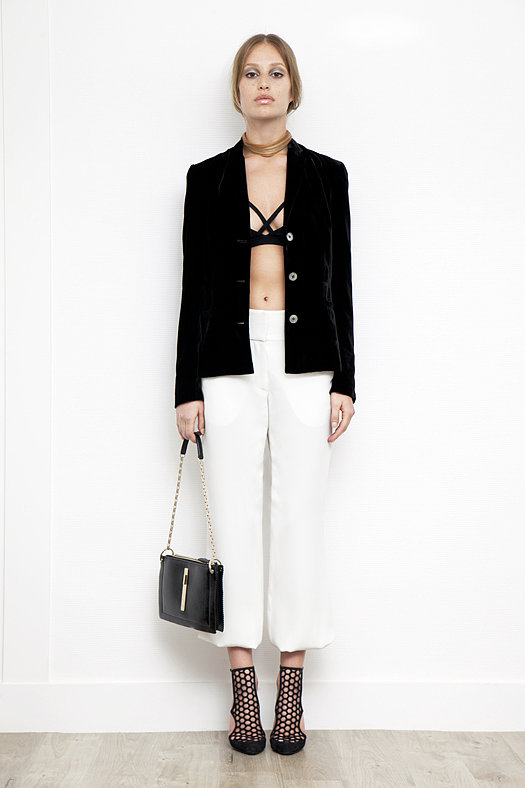 Viscose Sports Bra in Black ($150), Velvet Short Blazer in Black ($1,095), Elastic Bottom Silk Pant in Cream ($595), Secret Place Patent Mesh Sandal Bootie in Black ($895), Attraction Patent Shoulder Bag in Black ($1,795)
Photo courtesy of Tamara Mellon
Viscose Sports Bra in Black ($150), Velvet Short Blazer in Black ($1,095), Elastic Bottom Silk Pant in Cream ($595), Secret Place Patent Mesh Sandal Bootie in Black ($895), Attraction Patent Shoulder Bag in Black ($1,795)
Photo courtesy of Tamara Mellon