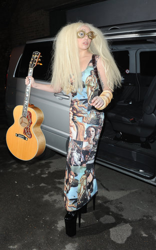 Lady Gaga was spotted again in London wearing a dress adorned with Botticelli's Birth of Venus. She accessorized her outfit with a guitar and a pair of goggles.
Lady Gaga was spotted again in London wearing a dress adorned with Botticelli's Birth of Venus. She accessorized her outfit with a guitar and a pair of goggles.