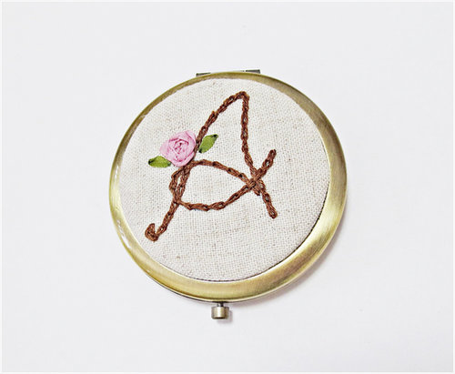 A cute compact gets an instant upgrade with a kitschy, embroidered mirror ($30).
A cute compact gets an instant upgrade with a kitschy, embroidered mirror ($30).