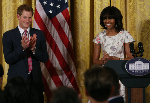 Prince Harry clapped as he stood next to Michelle Obama at a charity event in DC.
Prince Harry clapped as he stood next to Michelle Obama at a charity event in DC.