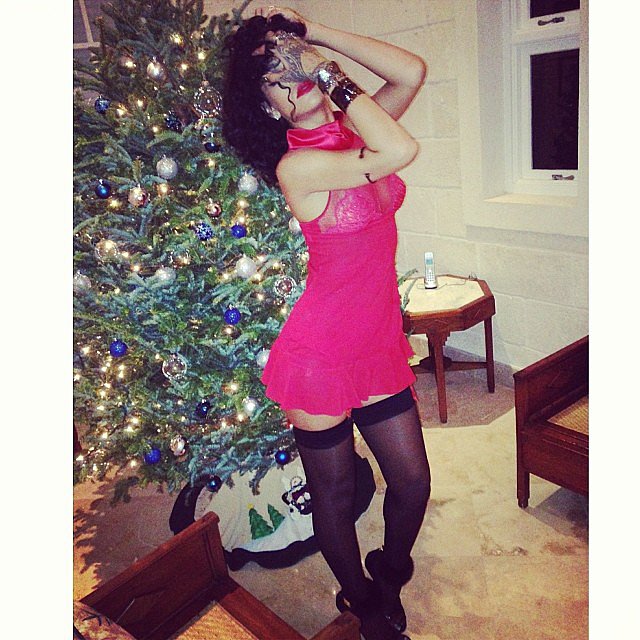 Rihanna posed in front of a Christmas tree while wearing a daring outfit in her native country of Barbados.
Source: Instagram user badgalriri
Rihanna posed in front of a Christmas tree while wearing a daring outfit in her native country of Barbados.
Source: Instagram user badgalriri
