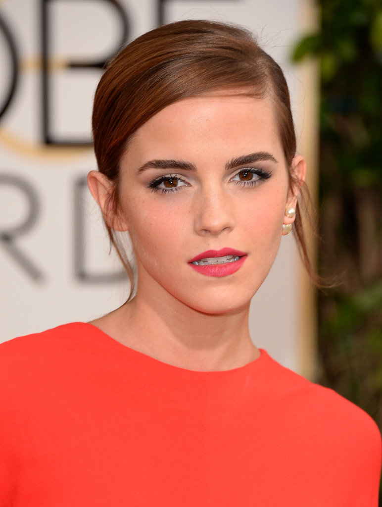 Emma Watson chose a matte pink lip to glam up her piecey low bun.
Emma Watson chose a matte pink lip to glam up her piecey low bun.