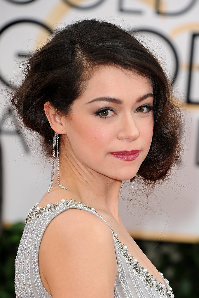 A silvery shadow, punchy lip, and coiled bob completed Tatiana Maslany's red carpet look.
A silvery shadow, punchy lip, and coiled bob completed Tatiana Maslany's red carpet look.
