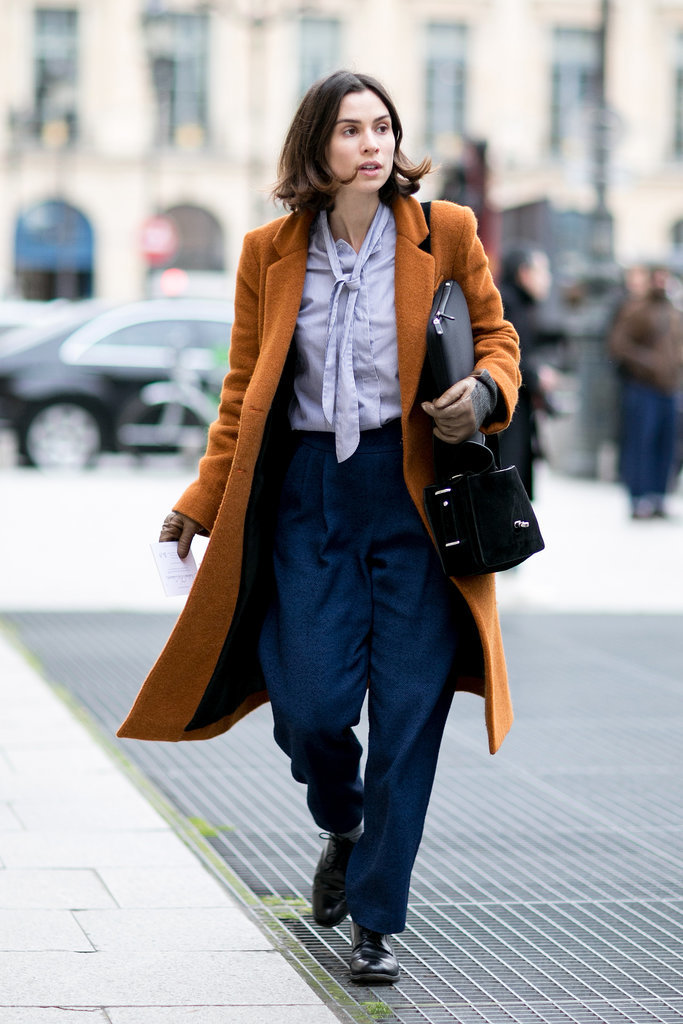 Bringing '70s chic to 2014 with a tie-neck blouse and trousers.
Bringing '70s chic to 2014 with a tie-neck blouse and trousers.