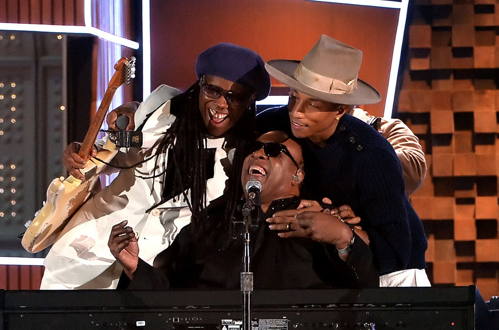 Pharrell Williams and Nile Rodgers hugged Stevie Wonder during their performance.
Pharrell Williams and Nile Rodgers hugged Stevie Wonder during their performance.