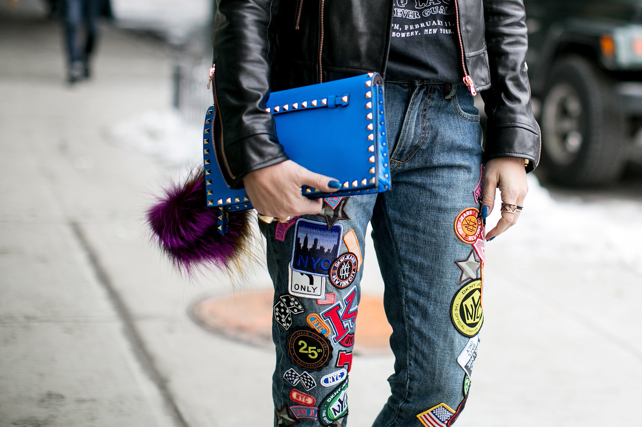 Patched-up denim is the street-cool contrast to a studded clutch. 

