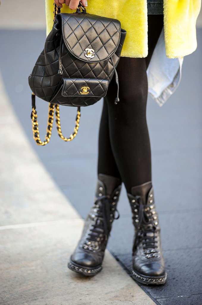 Tough-girl meets fashion fan with a Chanel backpack purse and combat boots. 
Source: Gorunway
