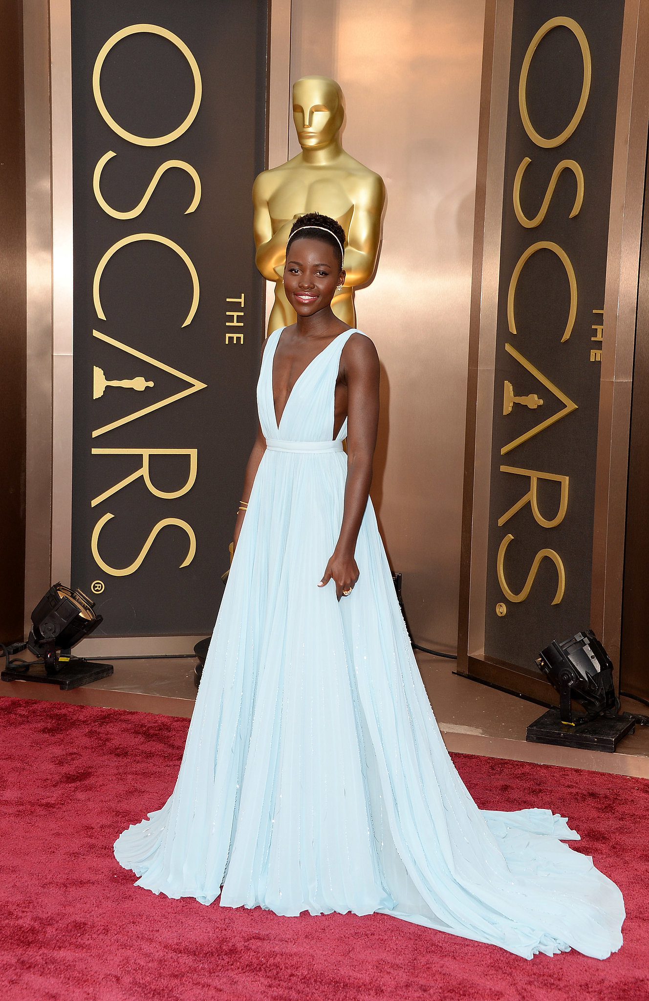 Lupita Nyong'o wearing a Prada gown at the 2014 Oscars. | Who Wore What