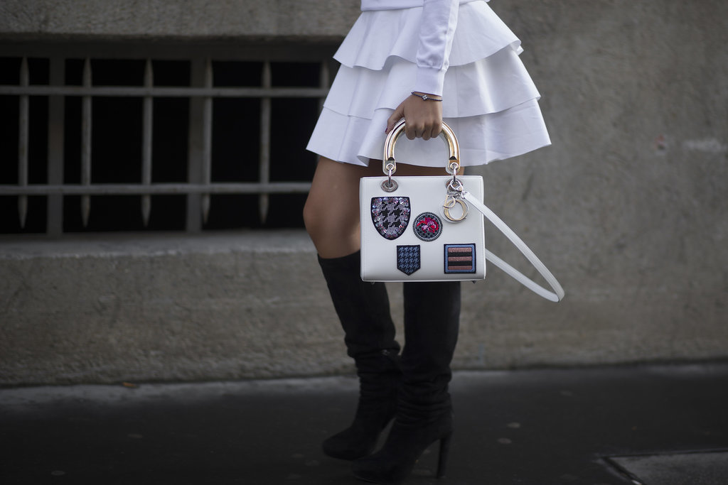 Talk about arm candy — this showgoer flashed a covet-worthy Dior bag.
Talk about arm candy — this showgoer flashed a covet-worthy Dior bag.
