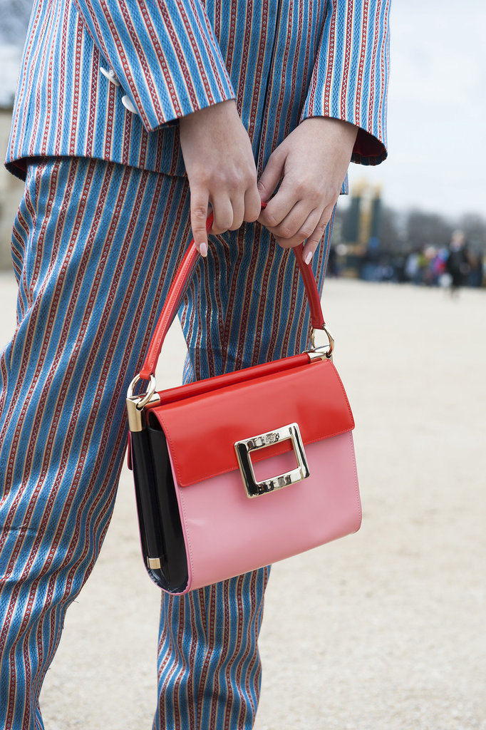 A menswear-inspired suit got finished with a totally ladylike bag.
A menswear-inspired suit got finished with a totally ladylike bag.