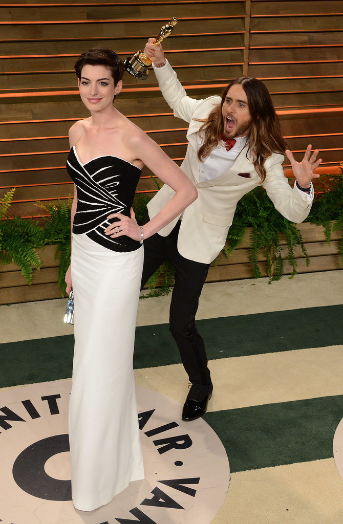 The fun photobombs continued after the Oscars, when Jared Leto snuck up behind Anne Hathaway on his way into the Vanity Fair bash.
The fun photobombs continued after the Oscars, when Jared Leto snuck up behind Anne Hathaway on his way into the Vanity Fair bash.