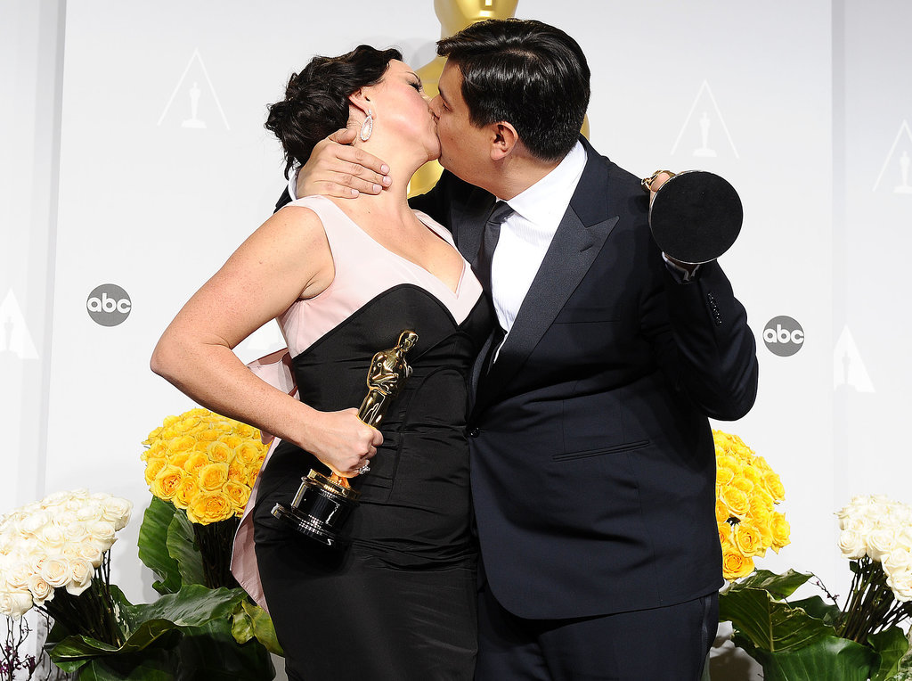The husband-and-wife team behind Frozen's "Let It Go," Robert Lopez and Kristen Anderson-Lopez, had a hot makeout after winning their Oscar.
The husband-and-wife team behind Frozen's "Let It Go," Robert Lopez and Kristen Anderson-Lopez, had a hot makeout after winning their Oscar.