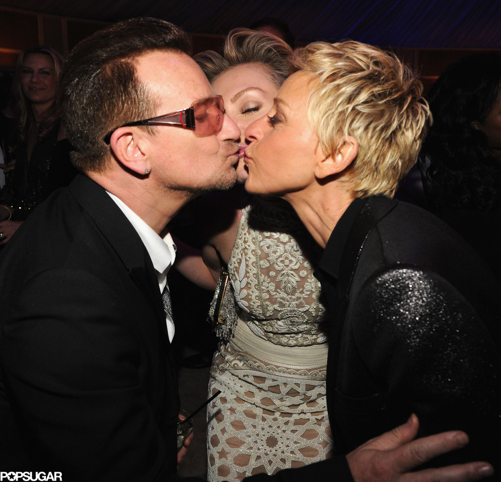 Ellen DeGeneres and Portia de Rossi went in for a three-way kiss with Bono at the Vanity Fair bash.
Ellen DeGeneres and Portia de Rossi went in for a three-way kiss with Bono at the Vanity Fair bash.