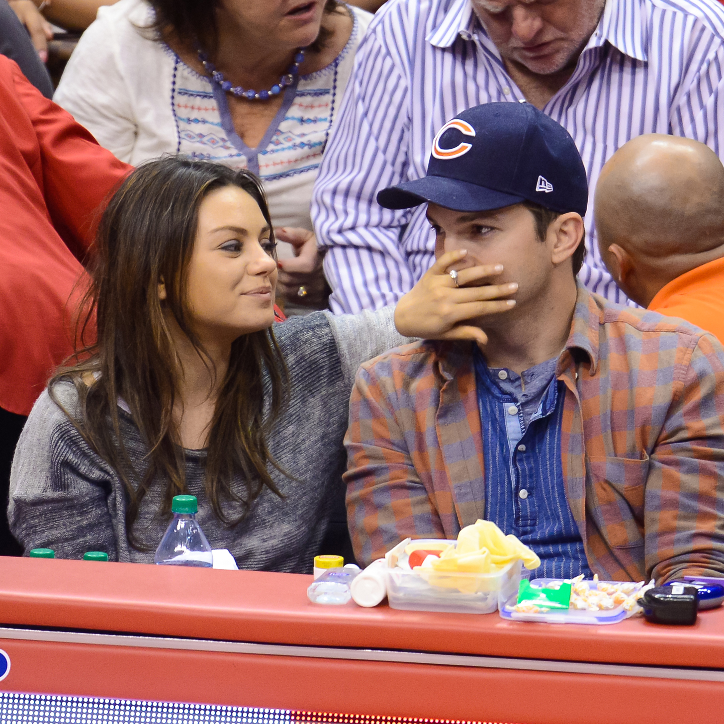 How Do Mila and Ashton Celebrate Their Baby News? On the Kiss Cam!